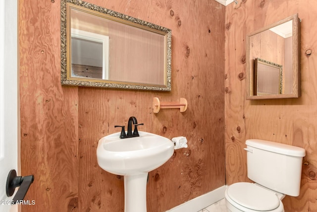 bathroom featuring toilet and a sink