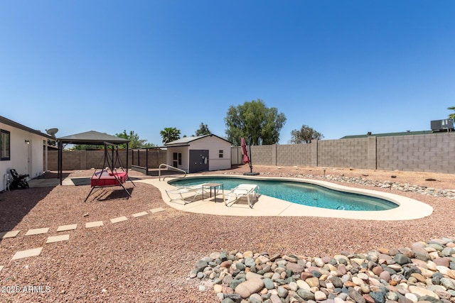 view of pool featuring a patio, a fenced backyard, a fenced in pool, and a gazebo