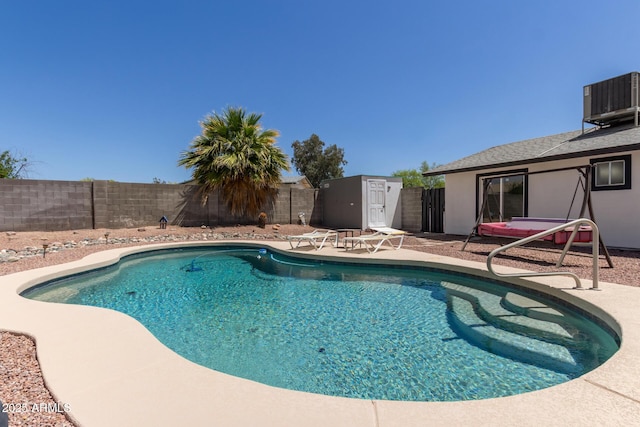 view of pool featuring cooling unit, a fenced backyard, a patio area, and a fenced in pool