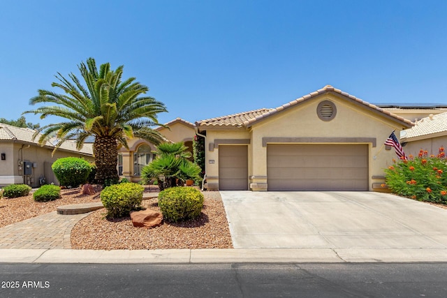 3166 N 158th Ave, Goodyear, AZ 85395 - view of front of home with driveway, an attached garage, stucco siding, and a tile roof