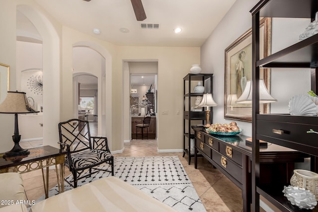 3166 N 158th Ave, Goodyear, AZ 85395 - living area featuring arched walkways, a ceiling fan, light tile patterned floors, and recessed lighting