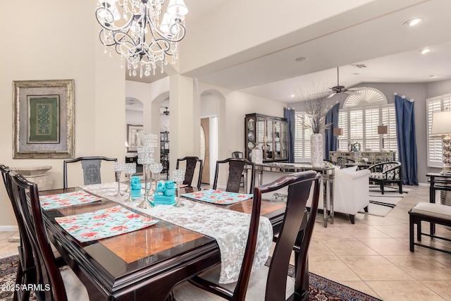 3166 N 158th Ave, Goodyear, AZ 85395 - tiled dining area with arched walkways, a chandelier, a ceiling fan, recessed lighting, and vaulted ceiling