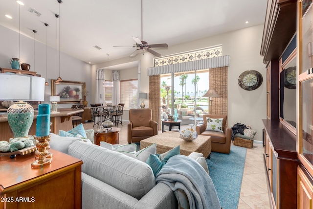 3166 N 158th Ave, Goodyear, AZ 85395 - living room featuring a ceiling fan, light tile patterned floors, recessed lighting, and lofted ceiling