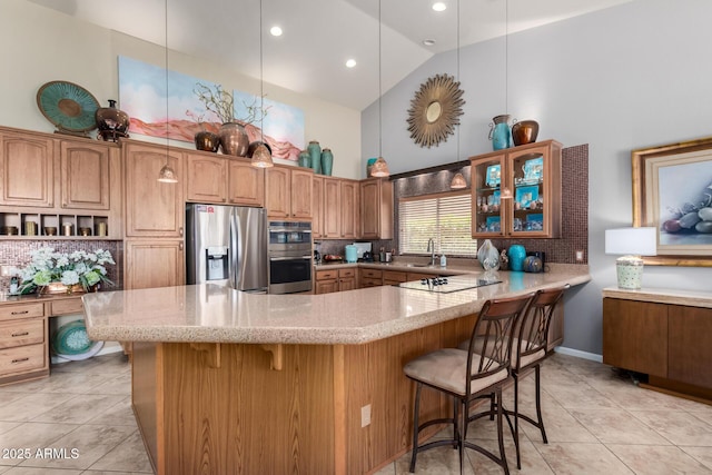 3166 N 158th Ave, Goodyear, AZ 85395 - kitchen featuring high vaulted ceiling, appliances with stainless steel finishes, light stone counters, a kitchen breakfast bar, and decorative backsplash