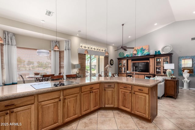 3166 N 158th Ave, Goodyear, AZ 85395 - kitchen featuring black electric stovetop, lofted ceiling, light tile patterned floors, open floor plan, and pendant lighting