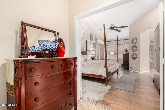 3166 N 158th Ave, Goodyear, AZ 85395 - bedroom with arched walkways, vaulted ceiling, light wood-type flooring, and a ceiling fan