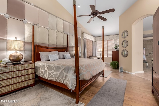 3166 N 158th Ave, Goodyear, AZ 85395 - bedroom featuring lofted ceiling, wood finished floors, and arched walkways