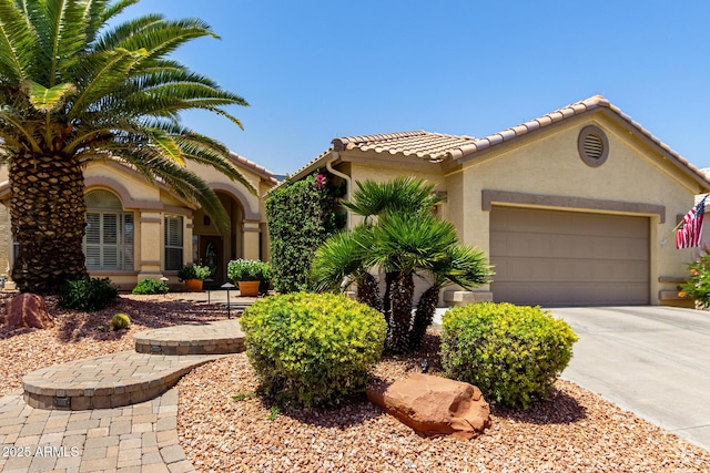 3166 N 158th Ave, Goodyear, AZ 85395 - mediterranean / spanish house with stucco siding, driveway, an attached garage, and a tile roof