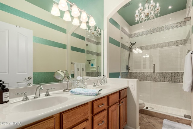 3166 N 158th Ave, Goodyear, AZ 85395 - full bath featuring a stall shower, double vanity, tile patterned flooring, and a chandelier