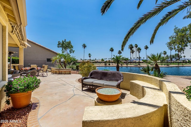 3166 N 158th Ave, Goodyear, AZ 85395 - view of patio / terrace with an outdoor living space and a water view