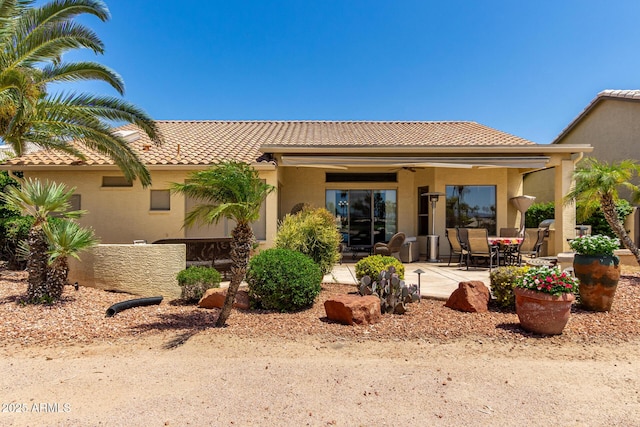 3166 N 158th Ave, Goodyear, AZ 85395 - rear view of property with a tile roof, a patio area, and stucco siding