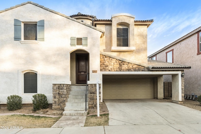 view of front of property with a garage