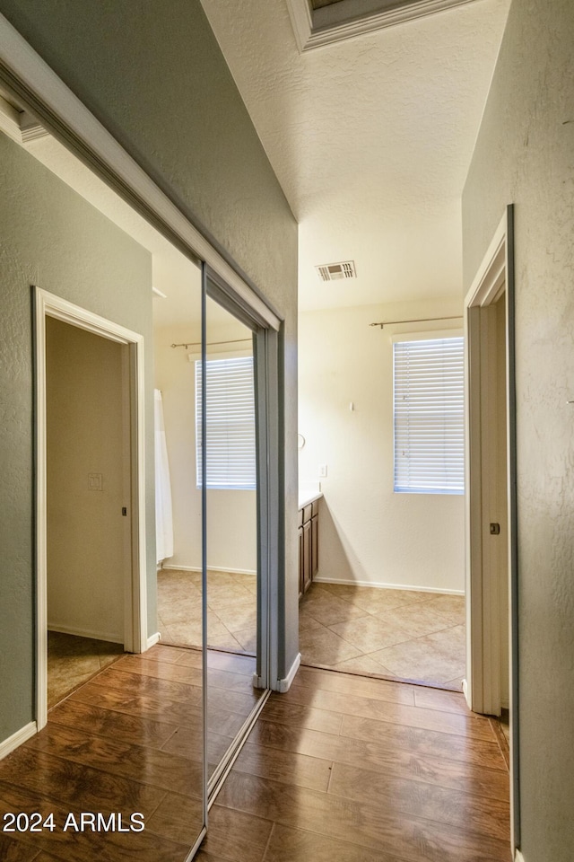 corridor featuring hardwood / wood-style flooring