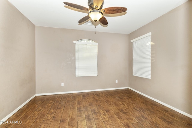 empty room featuring ceiling fan and wood-type flooring