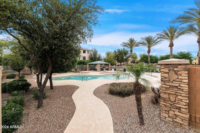 view of pool with a patio and a gazebo