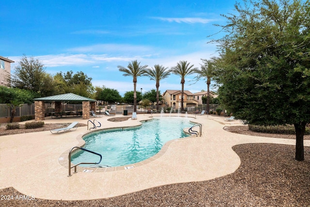 view of pool with a patio and a gazebo