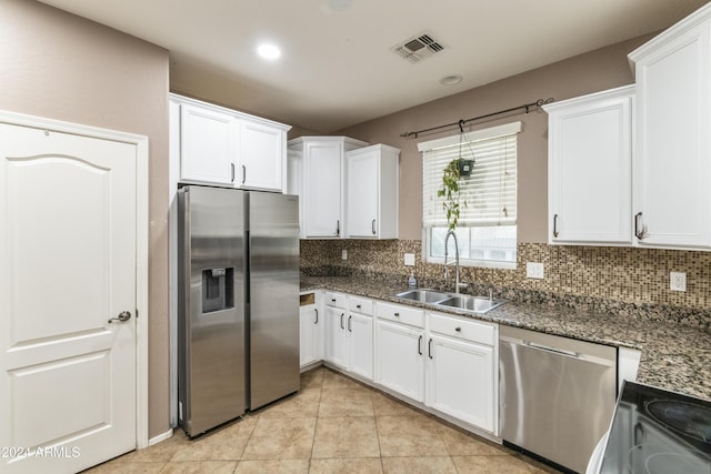 kitchen featuring appliances with stainless steel finishes and white cabinetry