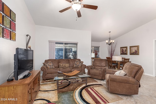 living room with ceiling fan with notable chandelier, vaulted ceiling, and light tile patterned flooring