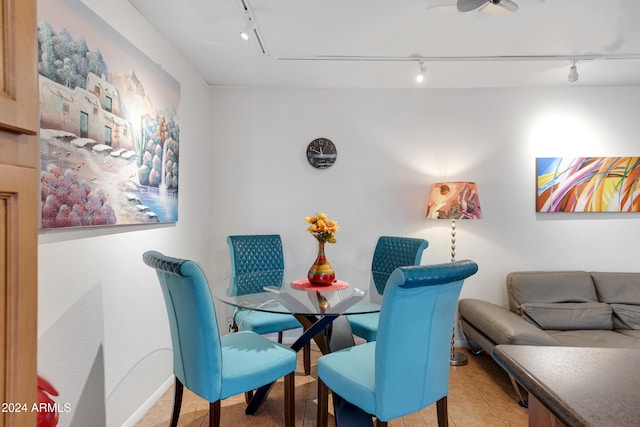 tiled dining area with rail lighting