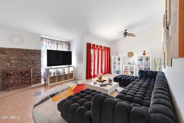 tiled living room featuring lofted ceiling and ceiling fan