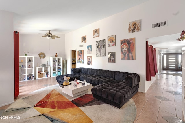 tiled living room with ceiling fan