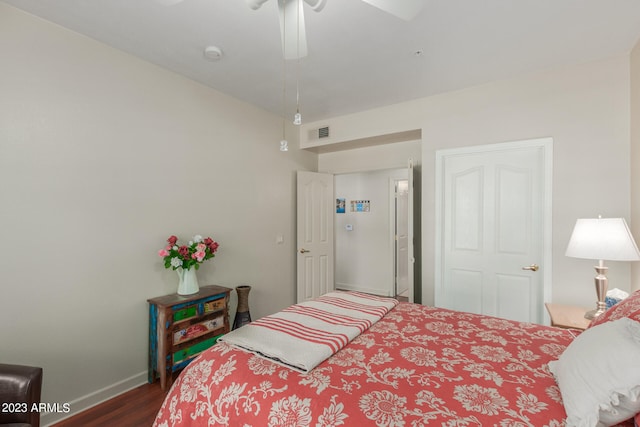 bedroom featuring ceiling fan and dark wood-type flooring