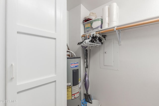 utility room featuring water heater