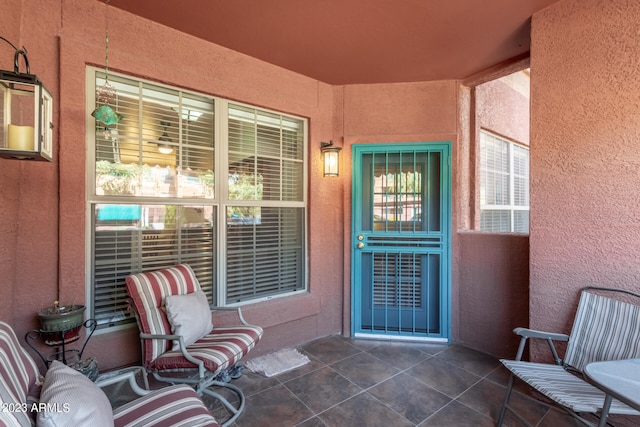 view of exterior entry featuring a patio