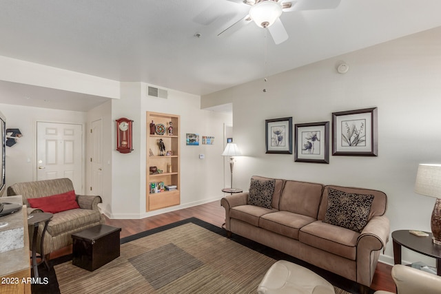 living room with ceiling fan and hardwood / wood-style flooring