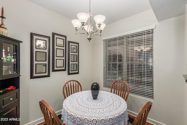 dining room with a chandelier