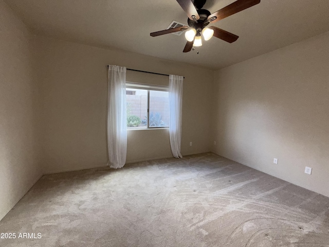 unfurnished room with carpet and ceiling fan