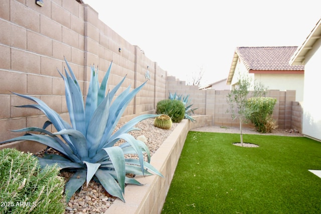 view of yard featuring a fenced backyard