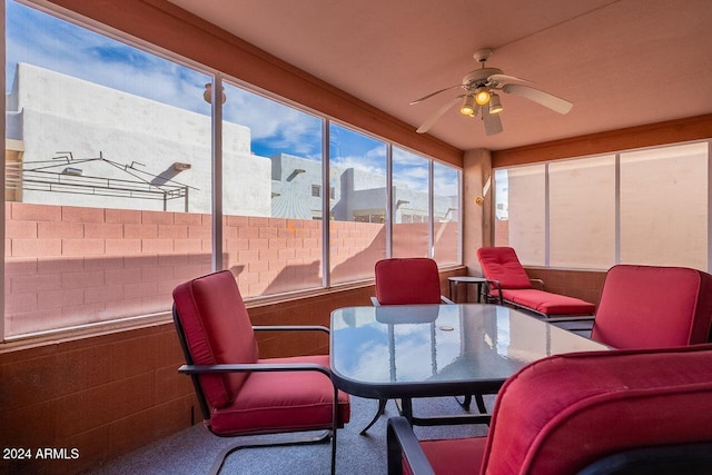 sunroom / solarium with ceiling fan