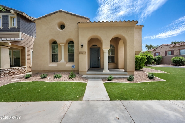 21017 W Edith Way, Buckeye, AZ 85396 - mediterranean / spanish house with stucco siding, a front lawn, and a tile roof