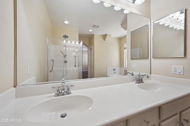 21017 W Edith Way, Buckeye, AZ 85396 - bathroom with a stall shower and double vanity