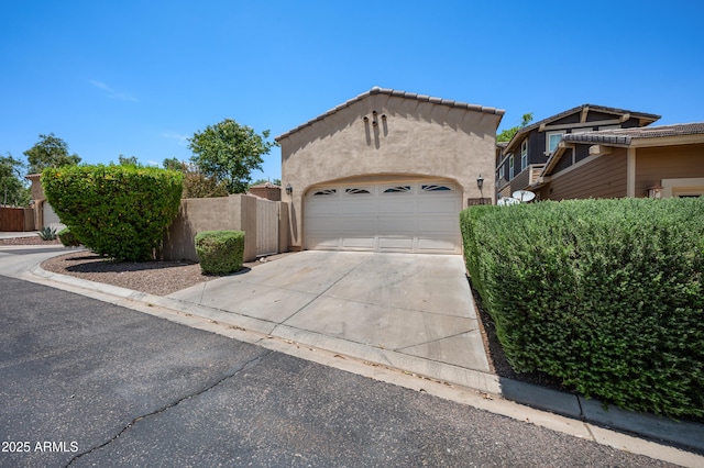21017 W Edith Way, Buckeye, AZ 85396 - view of front of property featuring driveway, a garage, and stucco siding