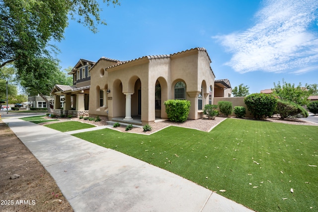 21017 W Edith Way, Buckeye, AZ 85396 - view of front of property featuring stucco siding, a front yard, and a tiled roof