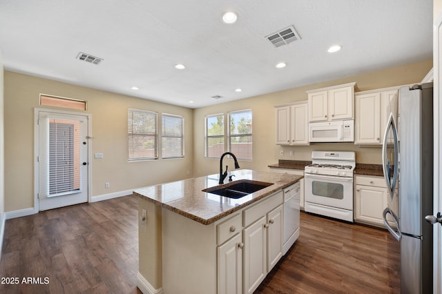 21017 W Edith Way, Buckeye, AZ 85396 - kitchen with white appliances, white cabinets, an island with sink, dark wood finished floors, and recessed lighting