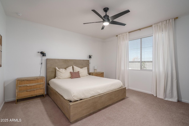 bedroom featuring ceiling fan, carpet floors, and baseboards