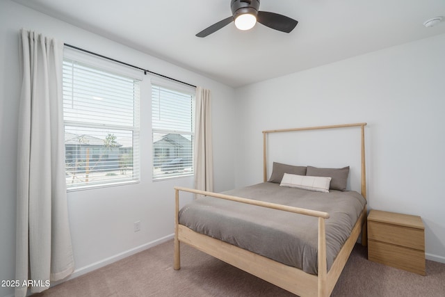 bedroom featuring carpet, a ceiling fan, and baseboards