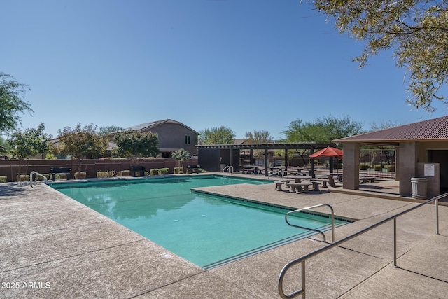 community pool featuring a gazebo, fence, and a patio