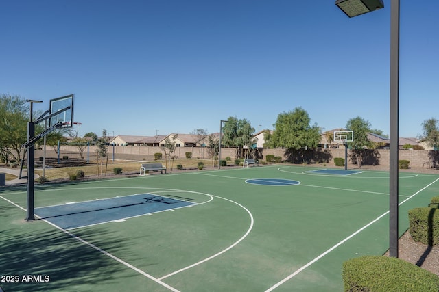 view of sport court with community basketball court and fence