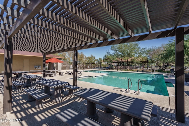 community pool featuring a patio area, fence, and a pergola