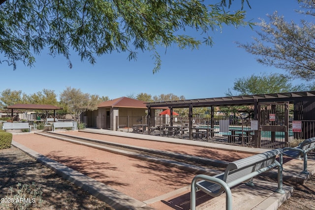 view of community with fence