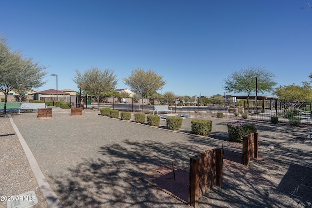 surrounding community featuring fence