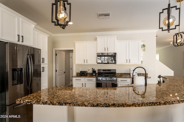 kitchen with ornamental molding, stainless steel appliances, white cabinetry, hanging light fixtures, and dark stone countertops