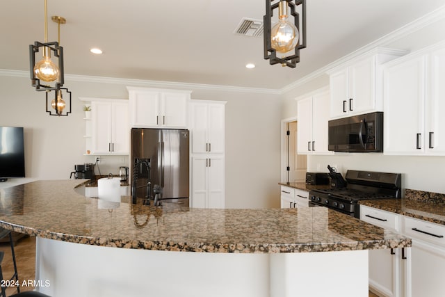 kitchen with pendant lighting, black appliances, white cabinets, and dark stone countertops