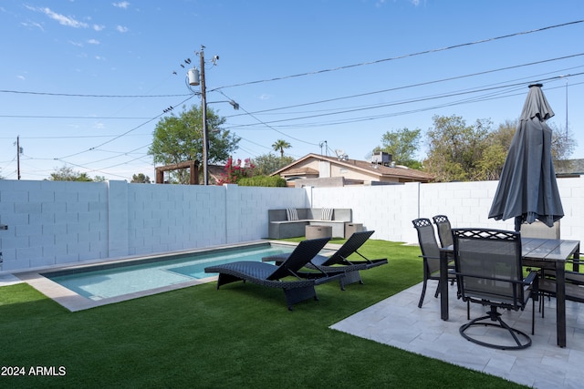 view of yard featuring a fenced in pool and a patio area