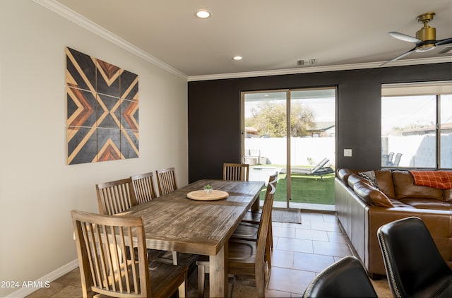 dining area featuring ceiling fan, tile patterned floors, and ornamental molding