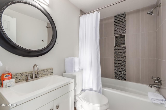 bathroom featuring shower / bath combo, vanity, and toilet